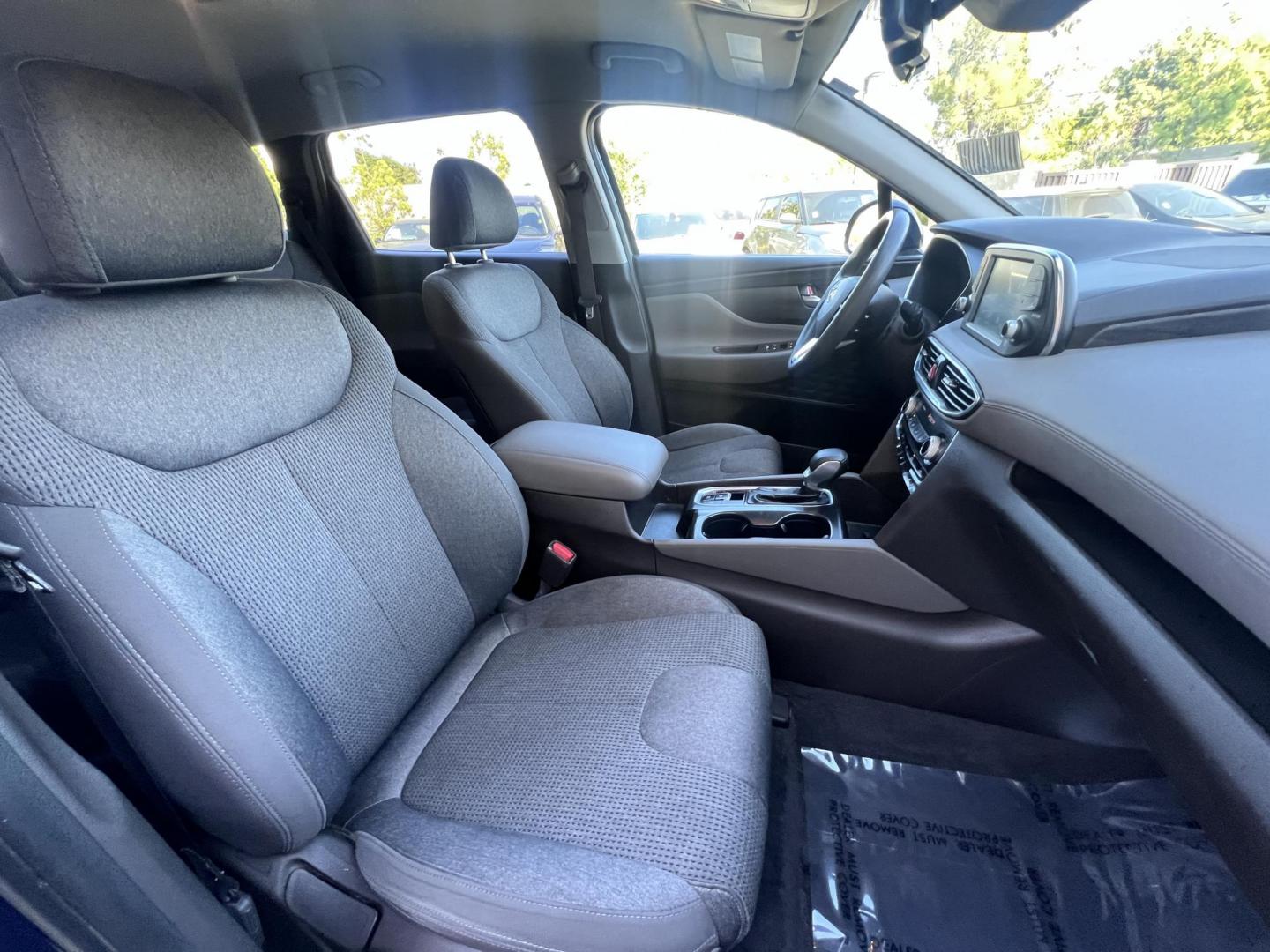 2019 Stormy BLue /Black Hyundai Santa Fe SEL 2.4 (5NMS33AD0KH) with an 2.4L L4 DOHC 16V engine, 8A transmission, located at 30 S. Berkeley Avenue, Pasadena, CA, 91107, (626) 248-7567, 34.145447, -118.109398 - Are you in the market for a stylish, reliable, and family-friendly SUV? Look no further than this 2019 Hyundai Santa Fe, available now at Crown City Motors, located at 30 S Berkeley Ave, Pasadena, CA 91107. As a premier Buy Here Pay Here dealership in Pasadena, we’re proud to offer this exceptiona - Photo#26
