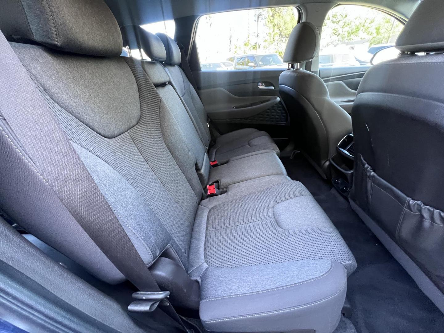 2019 Stormy BLue /Black Hyundai Santa Fe SEL 2.4 (5NMS33AD0KH) with an 2.4L L4 DOHC 16V engine, 8A transmission, located at 30 S. Berkeley Avenue, Pasadena, CA, 91107, (626) 248-7567, 34.145447, -118.109398 - Are you in the market for a stylish, reliable, and family-friendly SUV? Look no further than this 2019 Hyundai Santa Fe, available now at Crown City Motors, located at 30 S Berkeley Ave, Pasadena, CA 91107. As a premier Buy Here Pay Here dealership in Pasadena, we’re proud to offer this exceptiona - Photo#27
