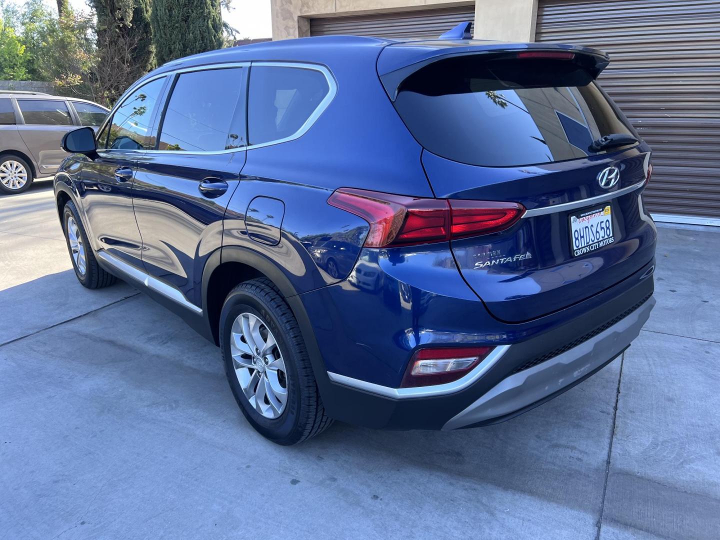 2019 Stormy BLue /Black Hyundai Santa Fe SEL 2.4 (5NMS33AD0KH) with an 2.4L L4 DOHC 16V engine, 8A transmission, located at 30 S. Berkeley Avenue, Pasadena, CA, 91107, (626) 248-7567, 34.145447, -118.109398 - Are you in the market for a stylish, reliable, and family-friendly SUV? Look no further than this 2019 Hyundai Santa Fe, available now at Crown City Motors, located at 30 S Berkeley Ave, Pasadena, CA 91107. As a premier Buy Here Pay Here dealership in Pasadena, we’re proud to offer this exceptiona - Photo#9
