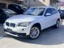 2013 White BMW X1 sDrive28i (WBAVM1C51DV) with an 2.0L L4 DOHC 16V engine, 8-Speed Automatic transmission, located at 30 S. Berkeley Avenue, Pasadena, CA, 91107, (626) 248-7567, 34.145447, -118.109398 - Crown City Motors is a used “Buy Here Pay Here” car dealer in Pasadena CA. “Buy Here Pay Here” financing, means that when you purchase your vehicle from our dealership, that you make the payments to the dealership as well. We do not need the banks approval to get you approved for a used auto - Photo#0