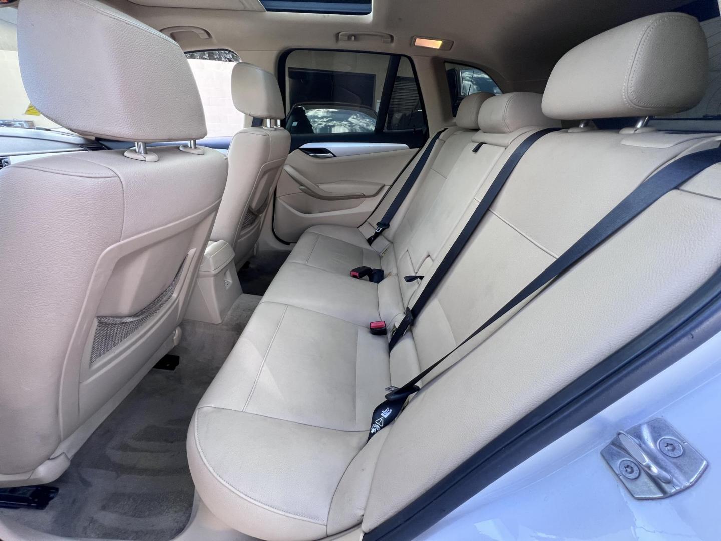 2013 White BMW X1 sDrive28i (WBAVM1C51DV) with an 2.0L L4 DOHC 16V engine, 8-Speed Automatic transmission, located at 30 S. Berkeley Avenue, Pasadena, CA, 91107, (626) 248-7567, 34.145447, -118.109398 - Crown City Motors is a used “Buy Here Pay Here” car dealer in Pasadena CA. “Buy Here Pay Here” financing, means that when you purchase your vehicle from our dealership, that you make the payments to the dealership as well. We do not need the banks approval to get you approved for a used auto - Photo#11