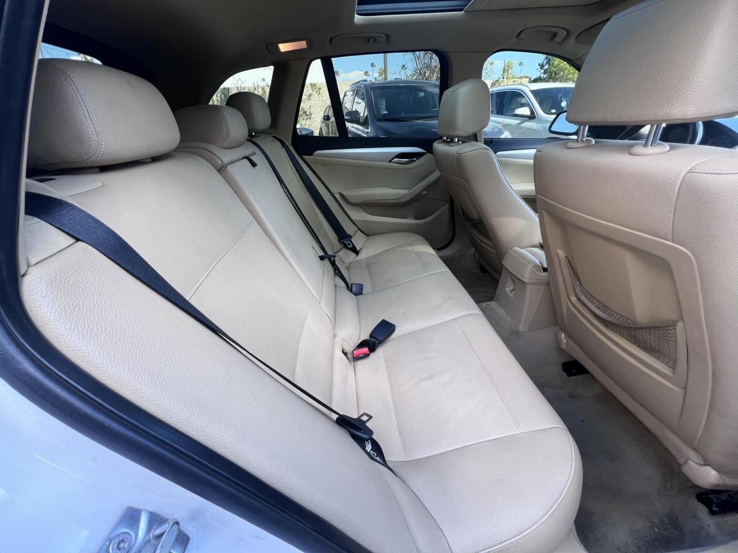 2013 White BMW X1 sDrive28i (WBAVM1C51DV) with an 2.0L L4 DOHC 16V engine, 8-Speed Automatic transmission, located at 30 S. Berkeley Avenue, Pasadena, CA, 91107, (626) 248-7567, 34.145447, -118.109398 - Crown City Motors is a used “Buy Here Pay Here” car dealer in Pasadena CA. “Buy Here Pay Here” financing, means that when you purchase your vehicle from our dealership, that you make the payments to the dealership as well. We do not need the banks approval to get you approved for a used auto - Photo#19
