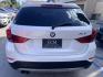 2013 White BMW X1 sDrive28i (WBAVM1C51DV) with an 2.0L L4 DOHC 16V engine, 8-Speed Automatic transmission, located at 30 S. Berkeley Avenue, Pasadena, CA, 91107, (626) 248-7567, 34.145447, -118.109398 - Crown City Motors is a used “Buy Here Pay Here” car dealer in Pasadena CA. “Buy Here Pay Here” financing, means that when you purchase your vehicle from our dealership, that you make the payments to the dealership as well. We do not need the banks approval to get you approved for a used auto - Photo#3