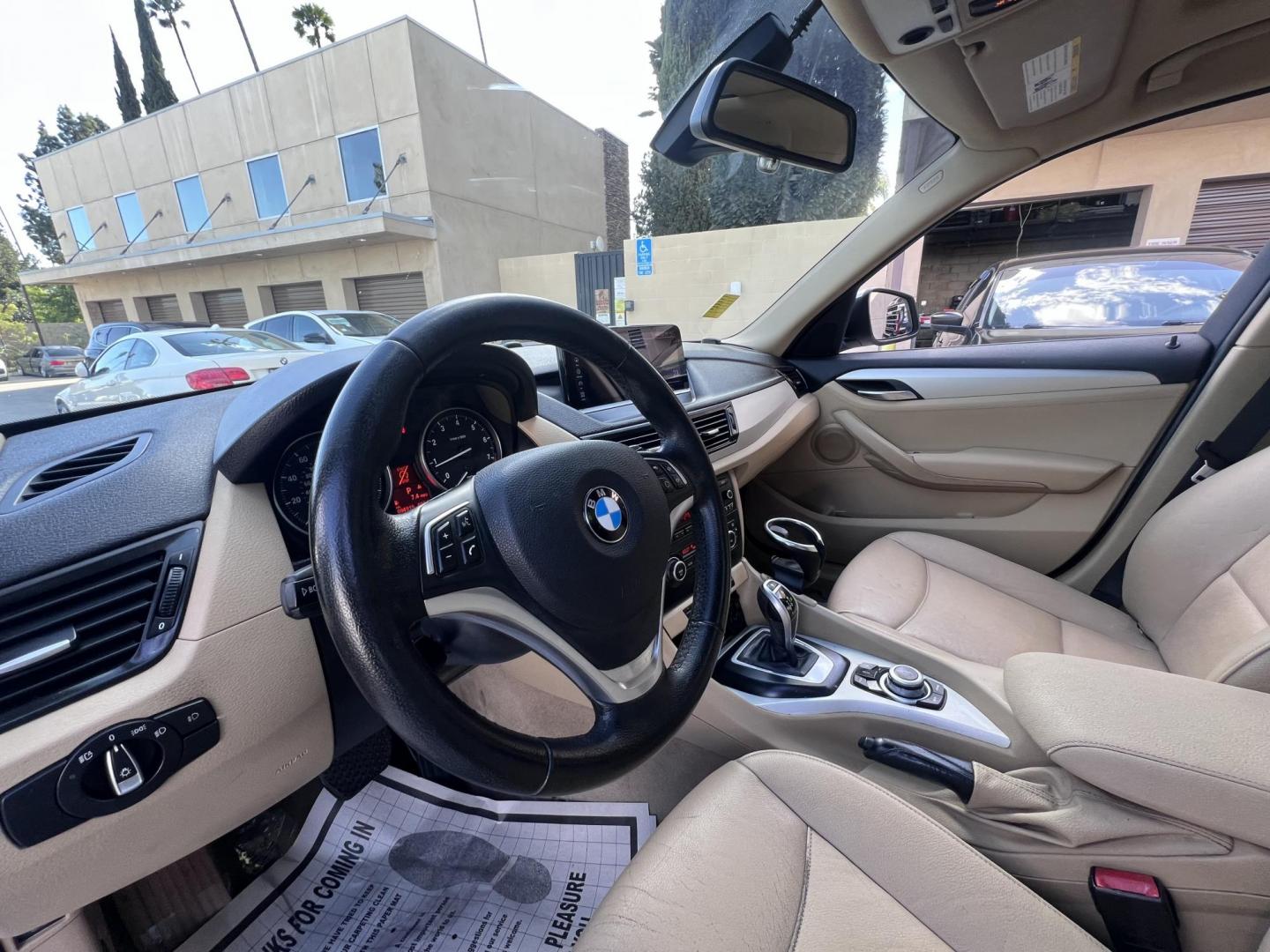 2013 White BMW X1 sDrive28i (WBAVM1C51DV) with an 2.0L L4 DOHC 16V engine, 8-Speed Automatic transmission, located at 30 S. Berkeley Avenue, Pasadena, CA, 91107, (626) 248-7567, 34.145447, -118.109398 - Crown City Motors is a used “Buy Here Pay Here” car dealer in Pasadena CA. “Buy Here Pay Here” financing, means that when you purchase your vehicle from our dealership, that you make the payments to the dealership as well. We do not need the banks approval to get you approved for a used auto - Photo#9